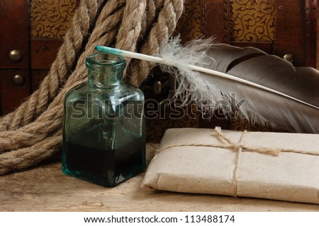 postal parcel, tobacco pipe and inkwell,  still life