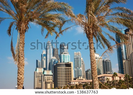 DUBAI, UAE - NOVEMBER 16: Modern buildings in Dubai Marina, on November 16, 2012, Dubai, UAE. Dubai was the fastest developing city in the world between 2002 and 2008.