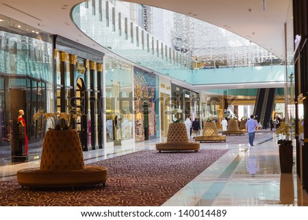 DUBAI, UAE - NOVEMBER 14: Inside modern luxuty mall on November 14, 2012 in Dubai. At over 12 million sq ft, it is the world\'s largest shopping mall based on total area.