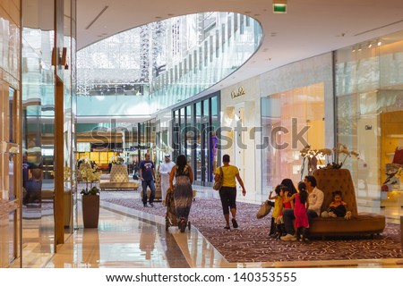 DUBAI, UAE - NOVEMBER 14: Inside modern luxuty mall on November 14, 2012 in Dubai. At over 12 million sq ft, it is the world\'s largest shopping mall based on total area.