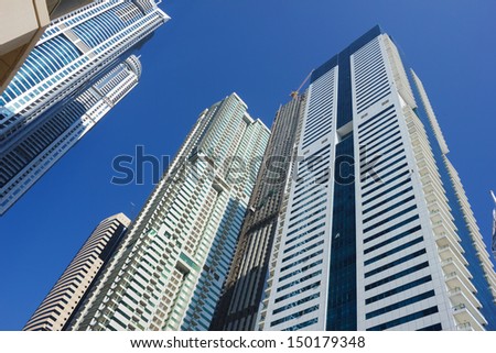 DUBAI, UAE - NOVEMBER 13: Modern buildings in Dubai Marina, on November 13, 2012, Dubai, UAE. Dubai was the fastest developing city in the world between 2002 and 2008.