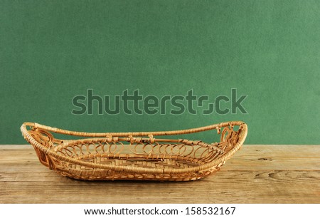 empty wicker basket on a wooden table