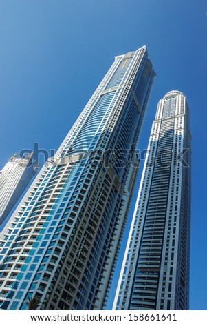 DUBAI, UAE - NOVEMBER 13: Modern buildings in Dubai Marina, on November 13, 2012, Dubai, UAE. Dubai was the fastest developing city in the world between 2002 and 2008.