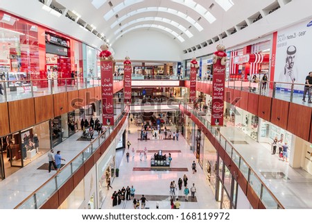 DUBAI, UAE - OCTOBER 31: Inside modern luxuty mall on October 31, 2013 in Dubai. At over 12 million sq ft, it is the world\'s largest shopping mall based on total area.