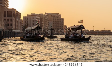 DUBAI, UAE-NOVEMBER 8, 2013: Ship in Port Saeed at sunset. The oldest commercial port of Dubai