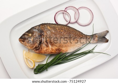dish of fried fish with onions