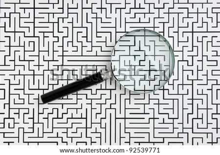 magnifying glass on the background of the labyrinth