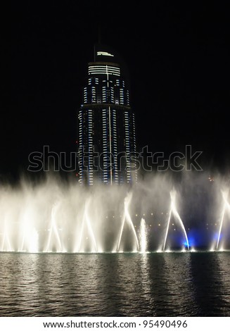 DUBAI, UAE - OCTOBER 10: The Dancing fountains downtown and in a man-made lake in Dubai, UAE on October 10, 2011. The Dubai Dancing fountains are world\'s largest fountains with height 150 m.
