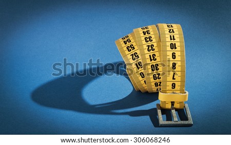 Yellow meter belt slimming on a blue background