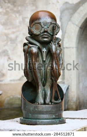 Statue of a birth machine baby, by H.R. Giger - August 15, 2011, entrance of  H.R. Giger museum in Gruyeres, Switzerland, Europe