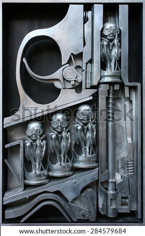 Birth machine silver metal sculpture by H.R. Giger - August 15, 2011, in front of H.R. Giger museum, Gruyeres, Switzerland, Europe