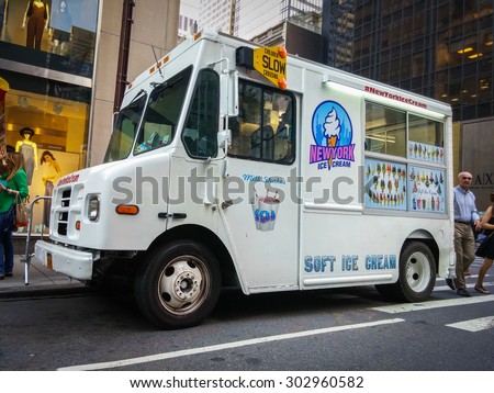 White ice cream truck on a street in New York City - July 1, 2015, 51st street and 5th avenue, New York City, NY, USA