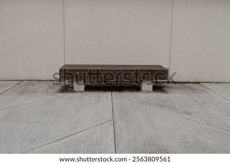 Similar – Image, Stock Photo Plain wooden bench in front of a wooden wall, with a window barricaded with square timbers.