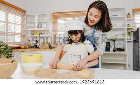 Similar – Image, Stock Photo Cook kneading dough with hand on table