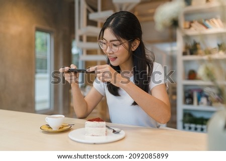 Similar – Image, Stock Photo Asian female taking selfie in underground passage