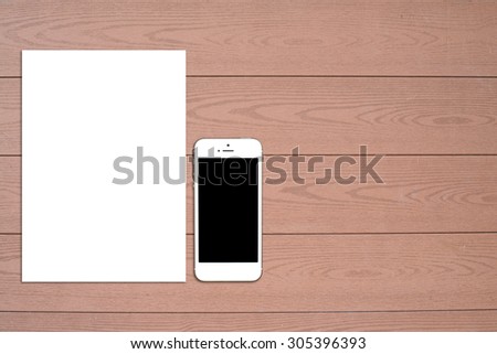 Fragment of blank stationery set. ID template on light wooden background. For design presentations and portfolios.