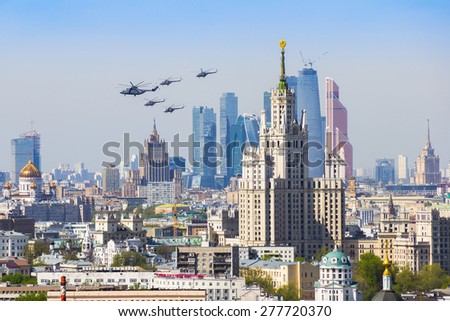Military helicopters are flying above the city, rehearsal of Victory Parade in Moscow