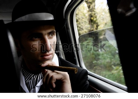 retro man with cigar in the car