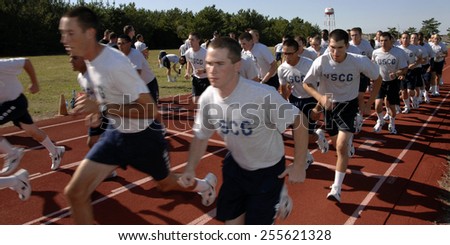 Two companies of Coast Guard recruits begin the first of six laps around a race track at Coast Guard Training Center Cape May, Wednesday, Sept. 12, 2007.