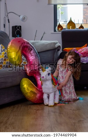 Similar – Image, Stock Photo Toddler seated on laminate floor; feet touch each other as legs splay out in open seated pose similar to butterfly pose in yoga