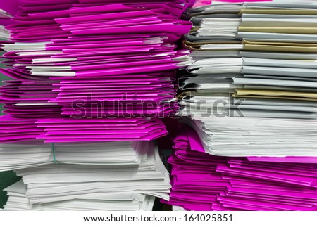 stacks of purple folders and documents in archive