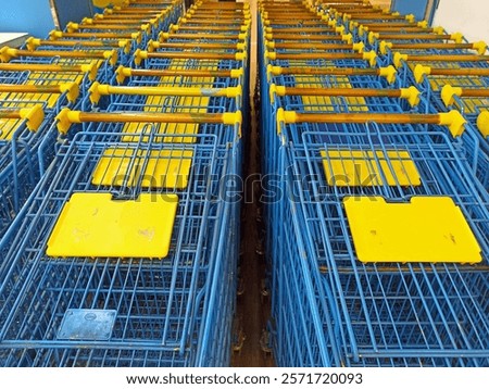 Similar – Image, Stock Photo Shopping carts arranged in the parking and entrance area of a giant warehouse supermarket, on the outskirts of Zaragoza city, Spain.