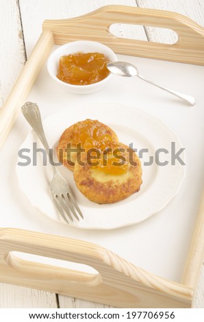 sweet potato cake with peach jam on a serving tray