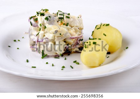 herring salad with lilac onion and jacket potatoes