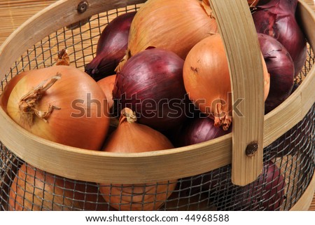 organic red and white onion in a basket