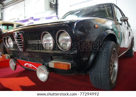 BUDAPEST-APRIL 15: Front of daily-used, dirty 1973\'s Alfa Romeo Alfetta at the 5th Oldtimer Expo on April 15, 2011 in Budapest, Hungary