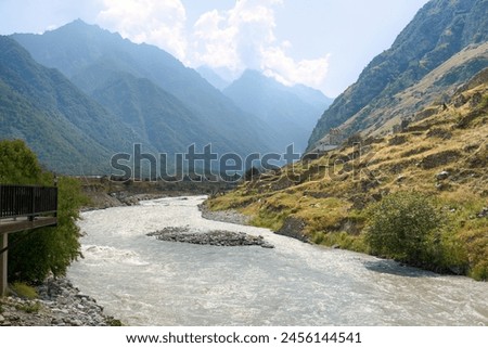 Similar – Image, Stock Photo beautiful clear mountain river Ara in long exposure with mountain in golden sunlight in background, Pyrenees, Spain