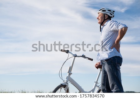 Similar – Image, Stock Photo Caucasian man riding a fixie