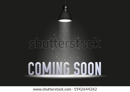 Coming soon text under spotlight. Vector illustration isolated on black