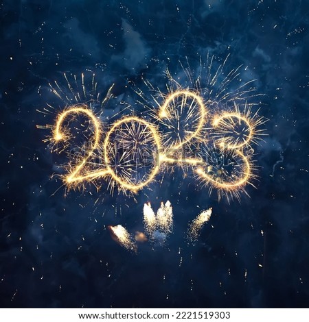 Photo of Happy New Year 2023. Beautiful Square creative holiday web banner or flyer with firework and sparkling numeric 2023 Year on night blue sky background