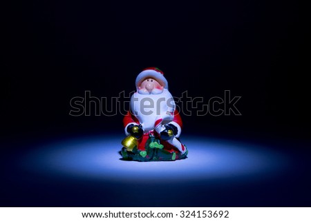 Santa Claus lighted torch from the top like a fairy tale on a black background