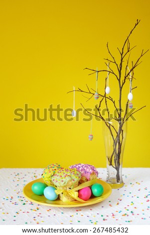 Orthodox Easter traditional bread Kulich, Panettone baking with easter eggs decoration on a branch