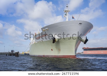 Port of Amsterdam, Noord-Holland/Netherlands - April 02-04-2015 - Cargo vessel Orange Blossom 2 started with mooring operations. When ship is moored it will discharging the pulped orange.