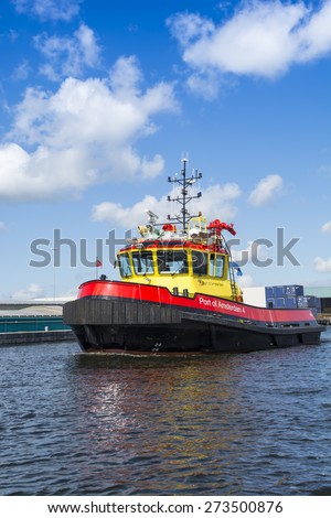 Port of Amsterdam, Noord-Holland/Netherlands - April 28-04-2015 - Vessel Port of Amsterdam 4 is sailing in port and is on duty. The port authorities always check the different activity\'s in port.