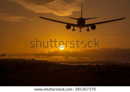 Silhouette from an airplane during sunrise.