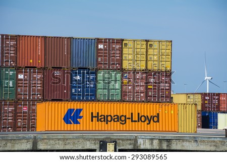 Port of Amsterdam, Noord-Holland/Netherlands - June 26-06-2015 - Orange Hapag-Lloyd container placed in front of Containers from different company\'s like MSC, Hapag-Lloyd, CMA CMG and TEX.