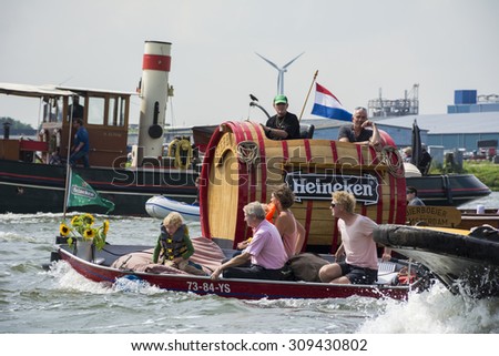 Port of Amsterdam, Noord-Holland/Netherlands - August 19-08-2015 - Heineken beer boat is sailing to Amsterdam during the biggest nautical event SAIL 2015.