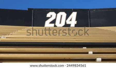 Similar – Image, Stock Photo Yellow, cheerful, empty seats from the chain carousel turn around in a circle, deserted, in front of a blue sky. Closed carousel at the fair, turns without guests. Crisis, closure, bankruptcy, bankruptcy, bankruptcy of the passenger business by Corona.