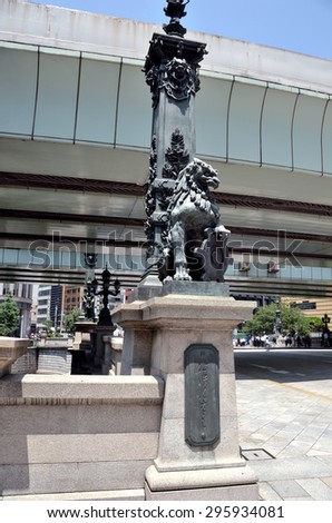 Tokyo, Japan - JULY 10, 2015: A photo of a Bronze lion sculpture in the Nihonbashi Bridge newel. Lion sculpture has represented the guardian of Tokyo.