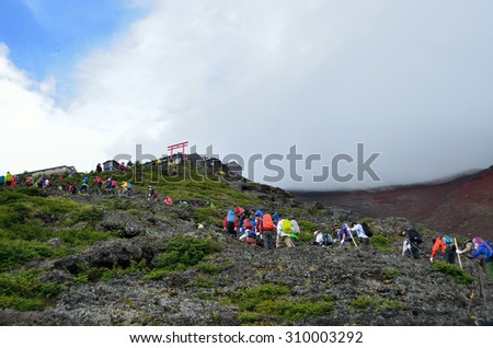Yamanashi, Japan - August 21, 2015: Mt. Fuji climbing. A photo of Yoshida trail before 7th station. Climbing season of Mt. Fuji is from early July until mid-September.