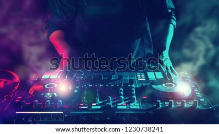 Similar – Image, Stock Photo DJ mixing music during party in club