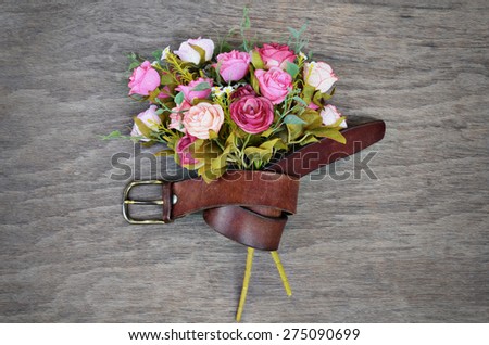 Oil Paint of Pink Old Rose Flora Bundle With Leather Belt on Wooden Plate Background Vintage Style for Texture Background Backdrop Card Wallpaper or Any Artwork