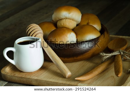 Still Life Warming Tone Dark Light Style of Mushroom Tuna Bread Recipe and Honey Cup in Wooden Plate on Old Wood Table - Texture Background