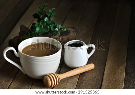 Still Life Warming Tone Dark Light Style of Coffee Cup and Honey Cup on Old Wood Table - Texture Background