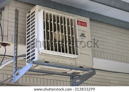 Zhudong town, Hsinchu county, Taiwan - Sep 6, 2015: Hitachi air conditioner in front of house.