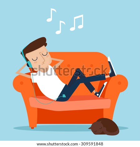 Man resting at home. Laying on sofa and listening music